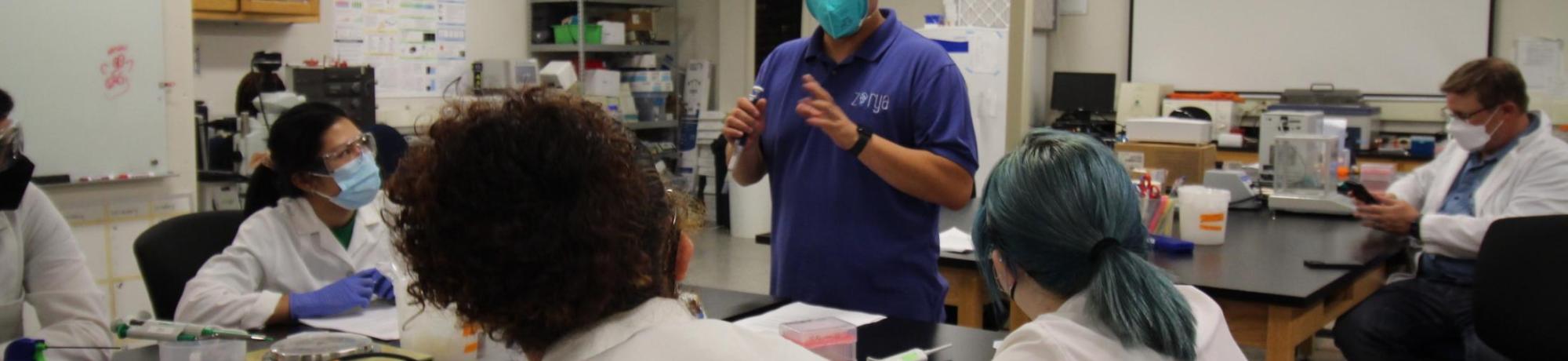 Advisor mentors students in the BioInnovation Lab.