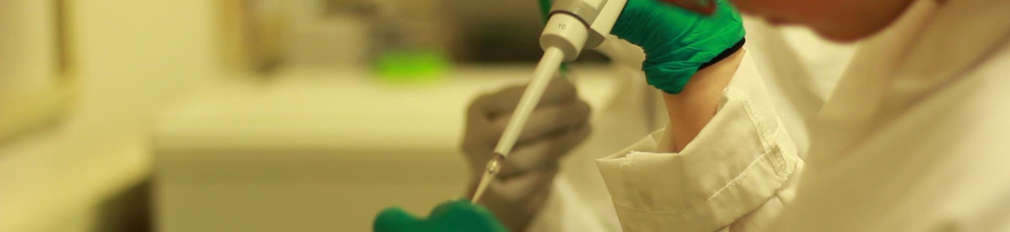 Student uses pipette in BioInnovation Lab.